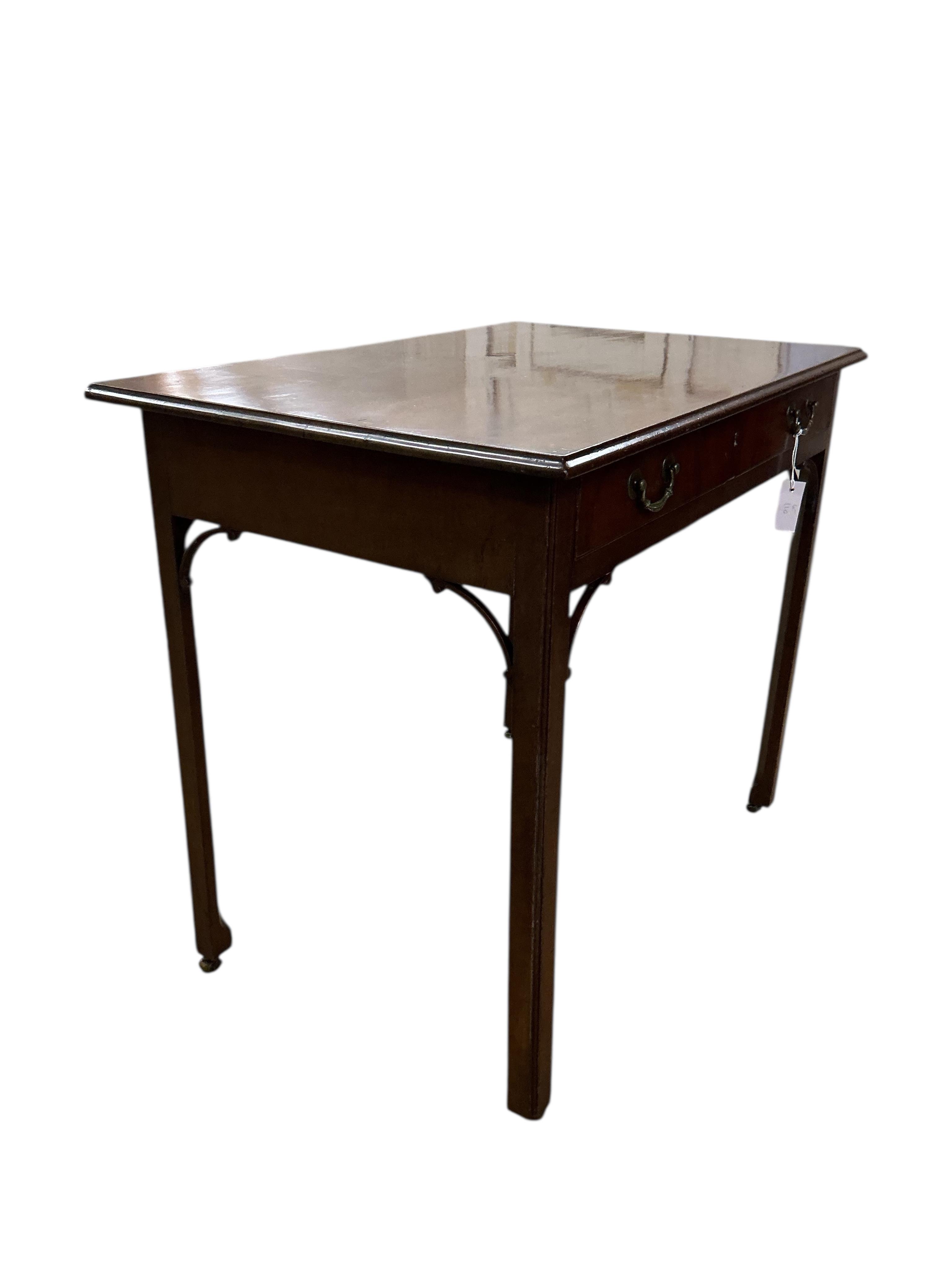 A George III mahogany serving table on chamfered square legs, width 91cm, depth 61cm, height 79cm